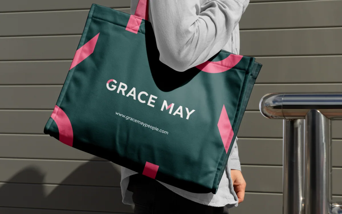 Grace May branded tote bag with a pink floral pattern