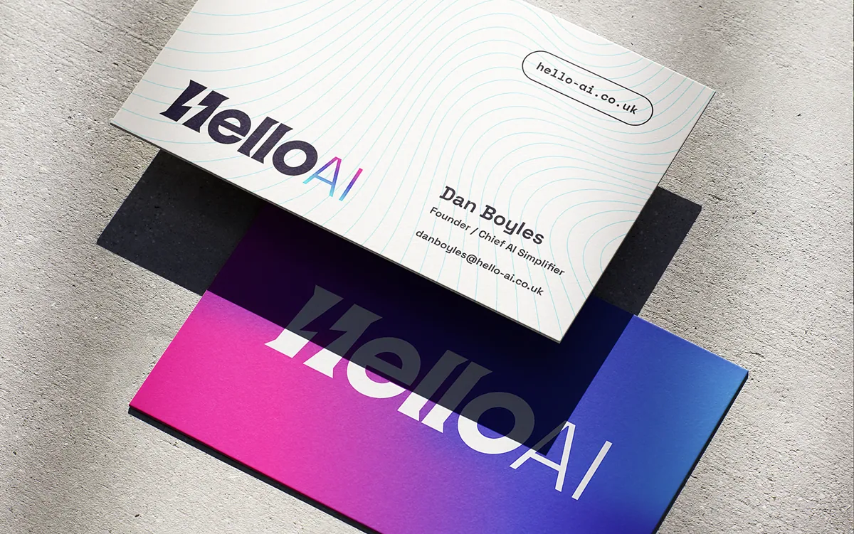 HelloAI business cards with the logo and pink-to-blue gradient branding