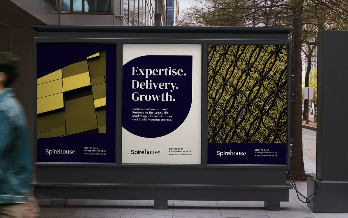 Spirehouse recruitment campaign posters displayed at a bus shelter