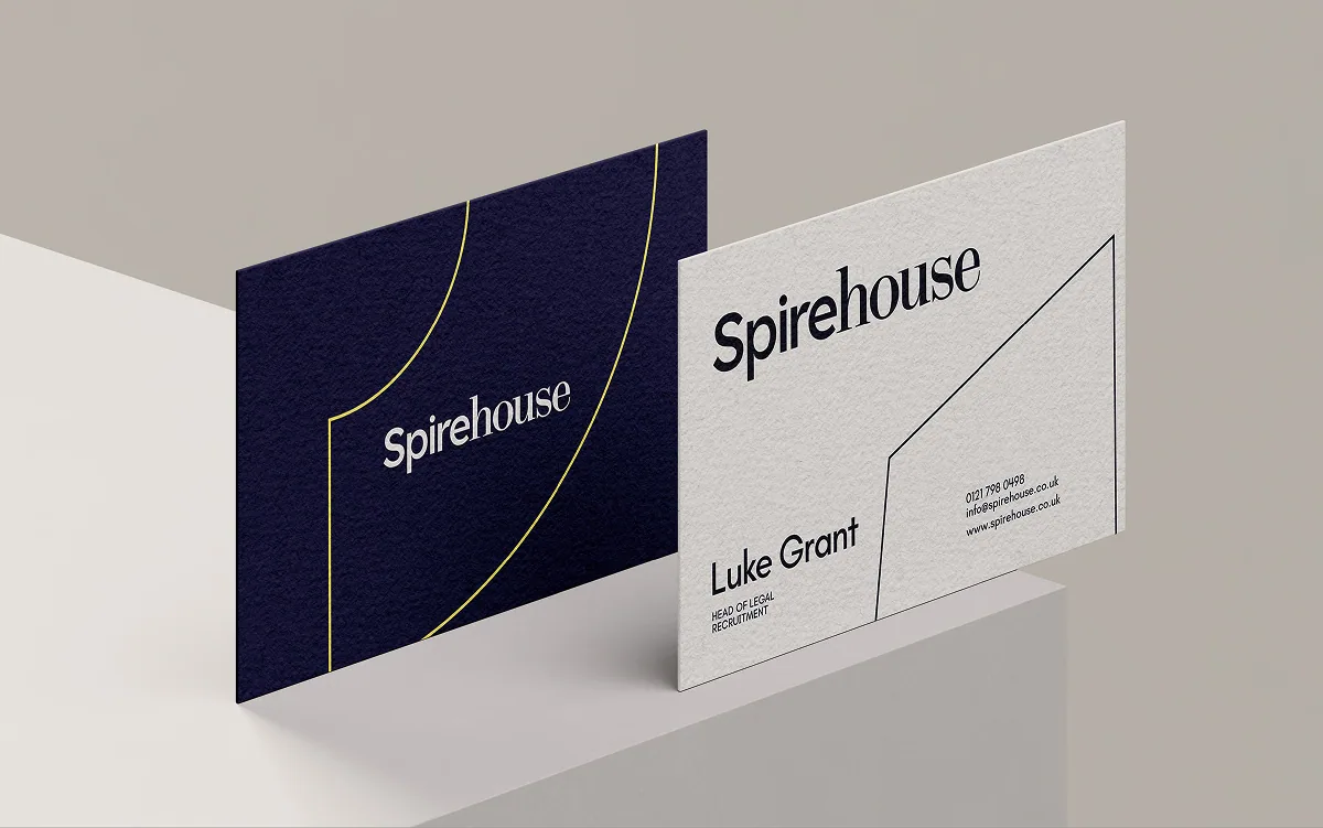 Spirehouse business cards with the Spirehouse logo and line motif